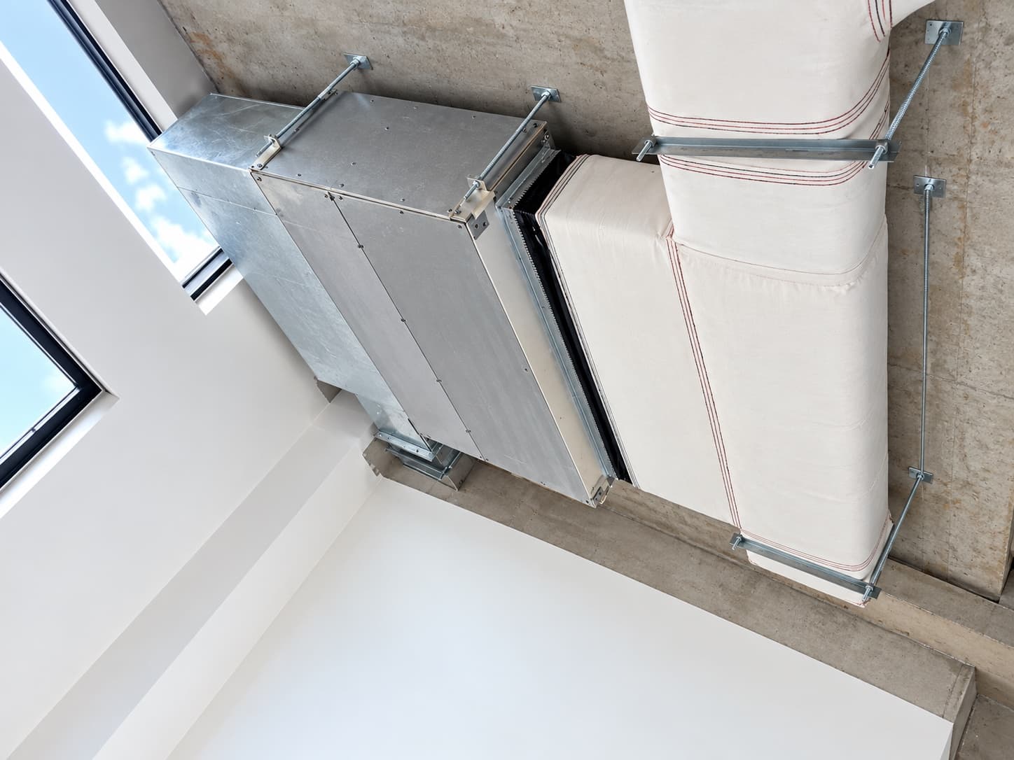 Ceiling concealed ducted indoor unit with insulated supply plenum