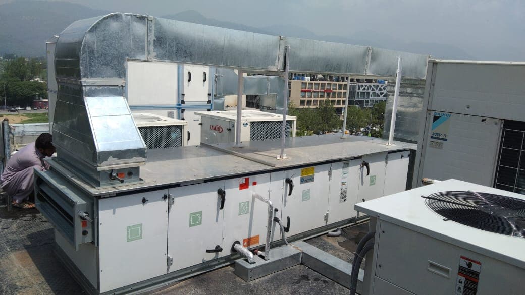 Rooftop air handling unit with galvanised ductwork at Evacuee Trust Complex