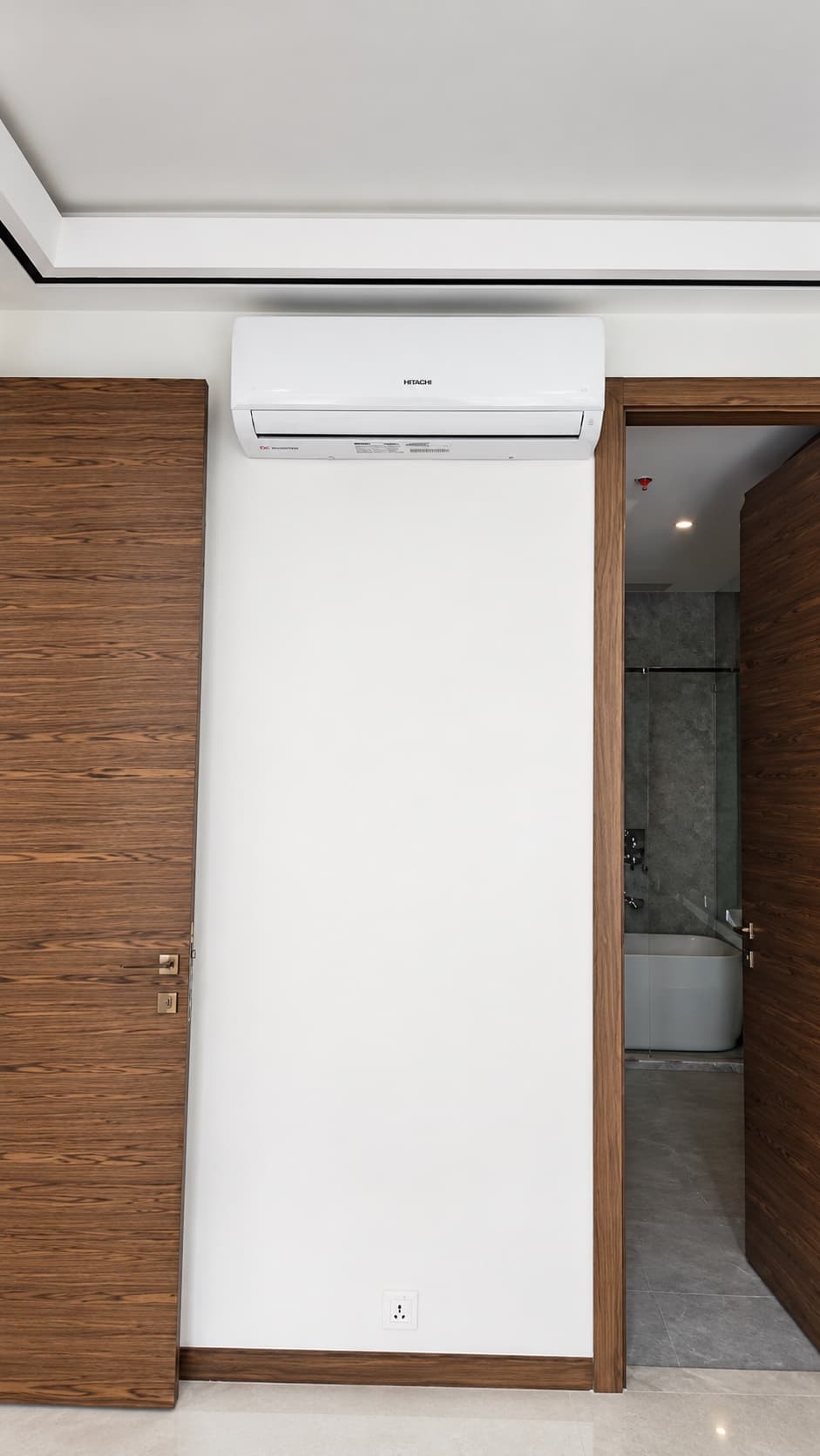 Wall-mounted indoor unit above a doorway at 29 Varient, Lahore