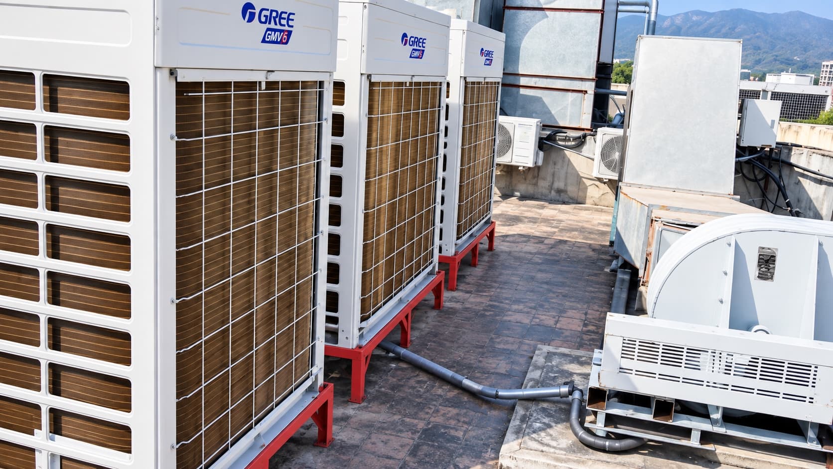 Gree VRF outdoor units and ventilation plant on the rooftop at Evacuee Trust Complex