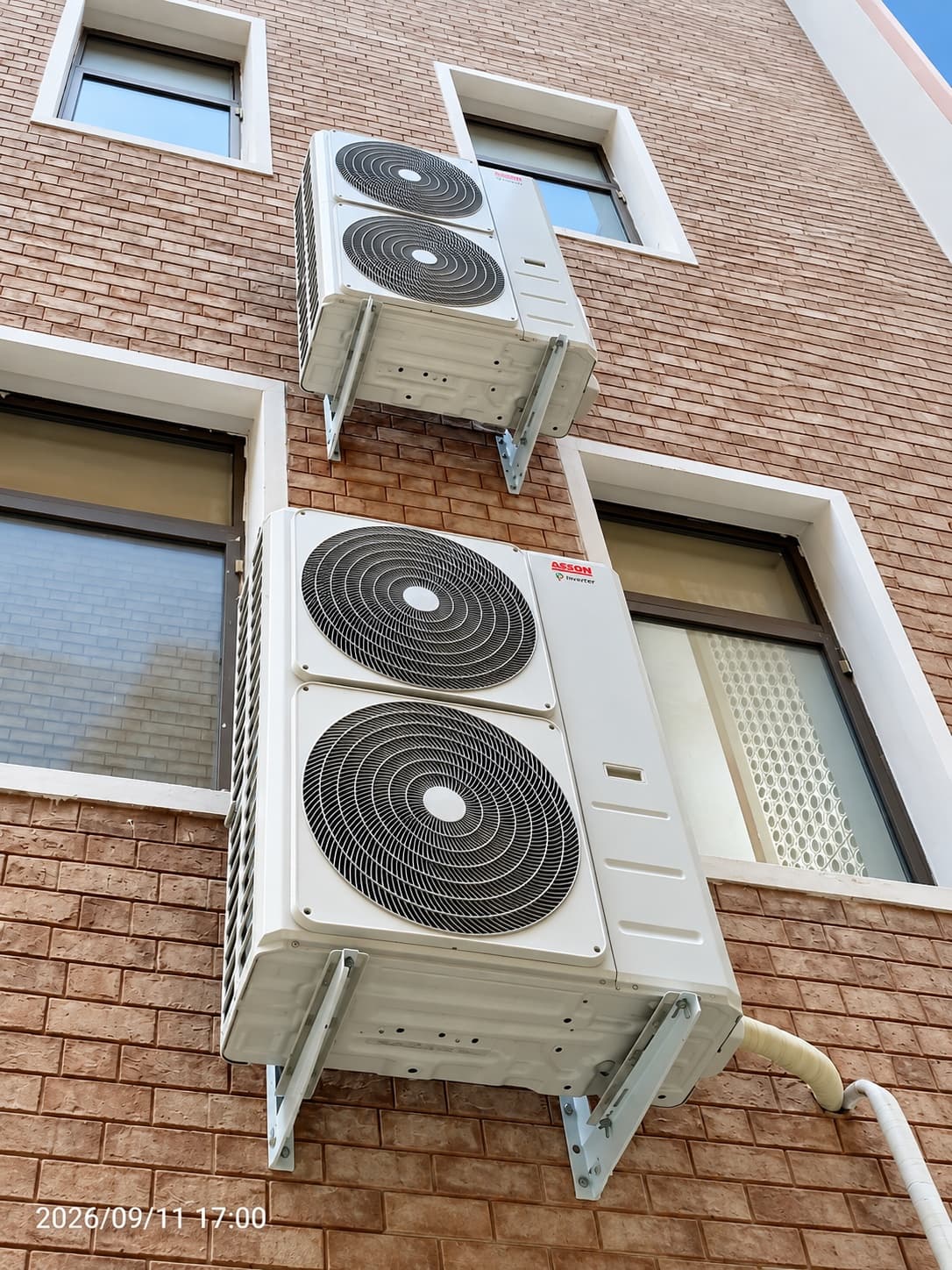 Wall-mounted outdoor units beside the windows at Kohat Institute of Medical Sciences