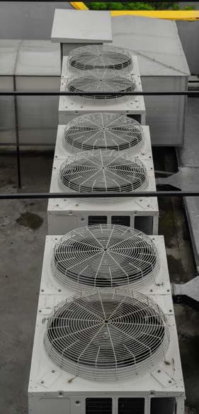 Row of outdoor unit fans seen from above on the rooftop at Quixel, Blue Area