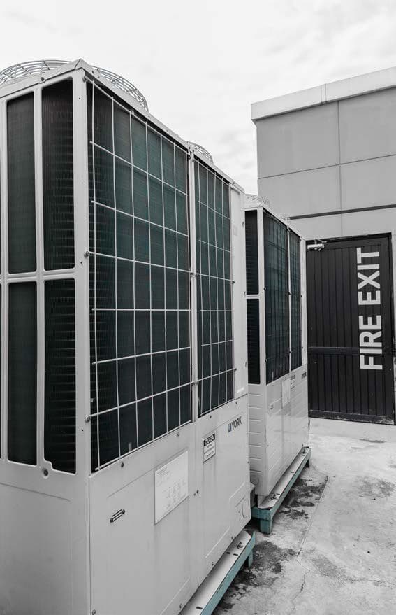 VRF outdoor units beside the rooftop fire exit at Quixel, Blue Area