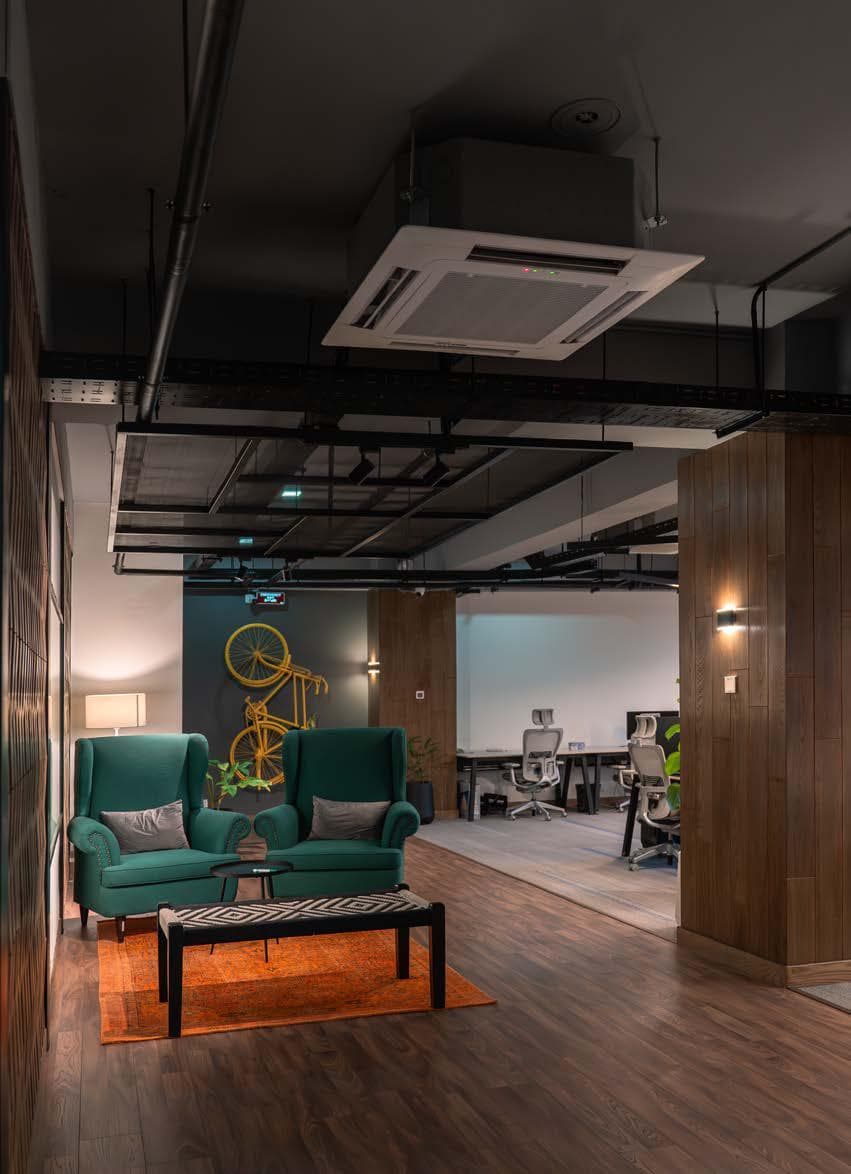 Contemporary seating area at Quixel with overhead ceiling cassette unit