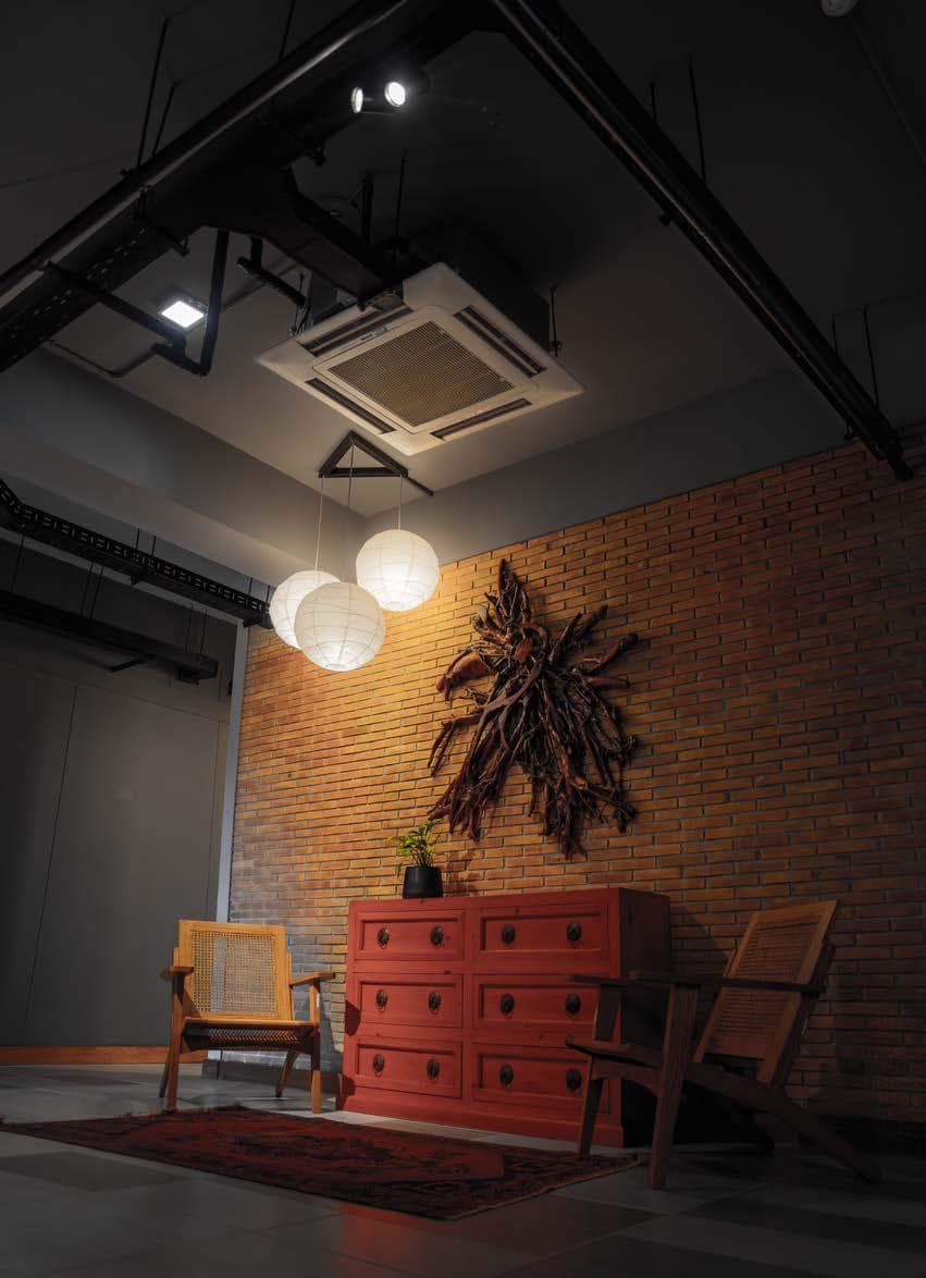 Reception and lounge area at Quixel with ceiling cassette unit on exposed ceiling